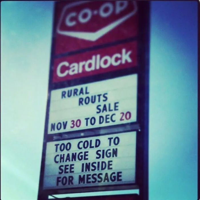 Funny sign at a gas station: "Too cold to change sign. See inside for message."