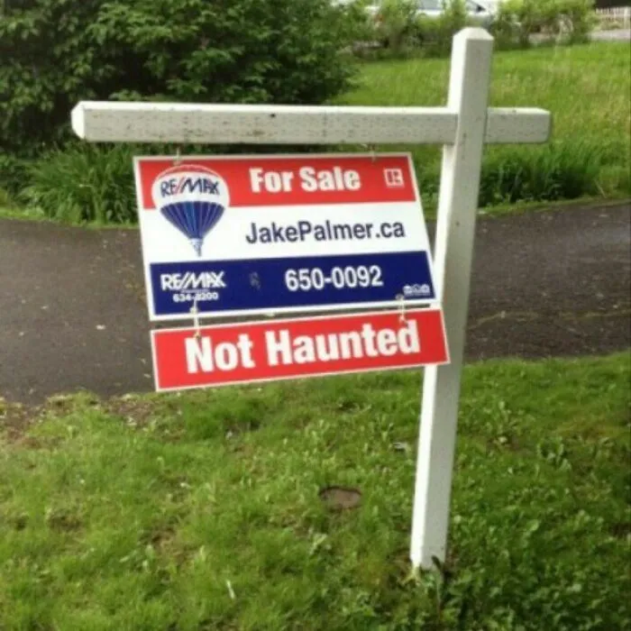 For sale sign reads "Not Haunted," showcasing funny signs on Instagram.