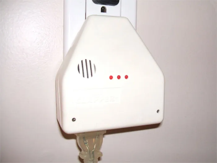 Vintage sound-activated gadget plugged into wall outlet, showcasing old gadgets that were trendsetters in their time.