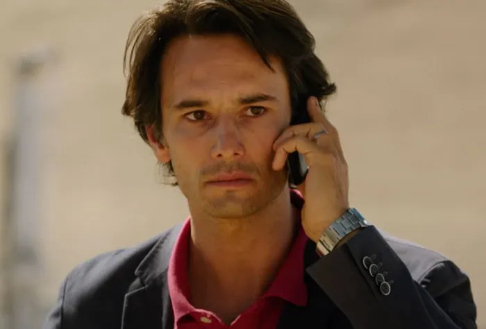 Laurence talking on the phone