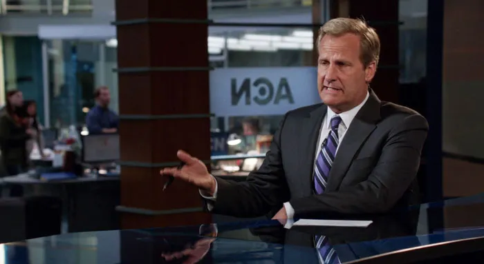 News reposter sitting and gesticulating with hands 