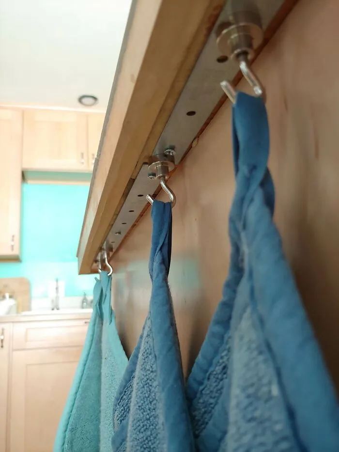 I Had Nowhere To Put Potholders In My Kitchen, So I Put A Strip Of Steel Under The Lip Of My Counter, And Used Magnet Hooks To Hang Them
