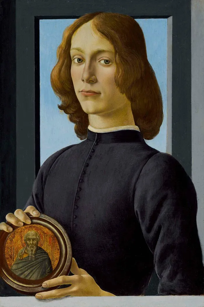 Portrait Of A Young Man Holding A Roundel