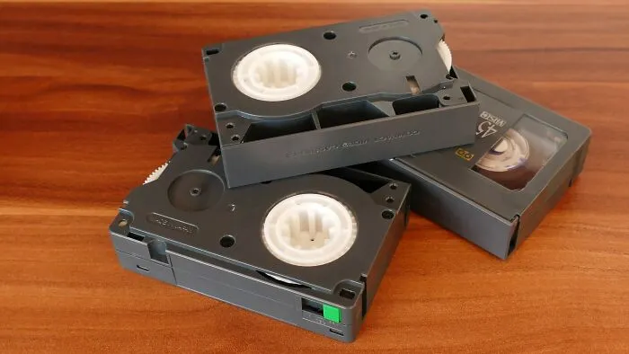 Three VHS Tapes In The Table 