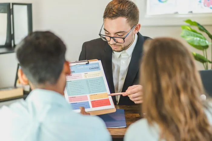 Man Presenting Ideas To A Couple