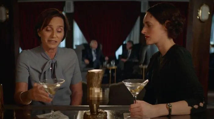 Belinda drinking and talking with Fleabag