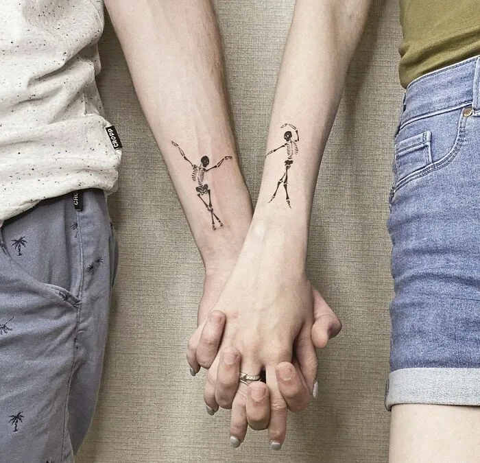 Paired Tattoo With Dancing Skeletons