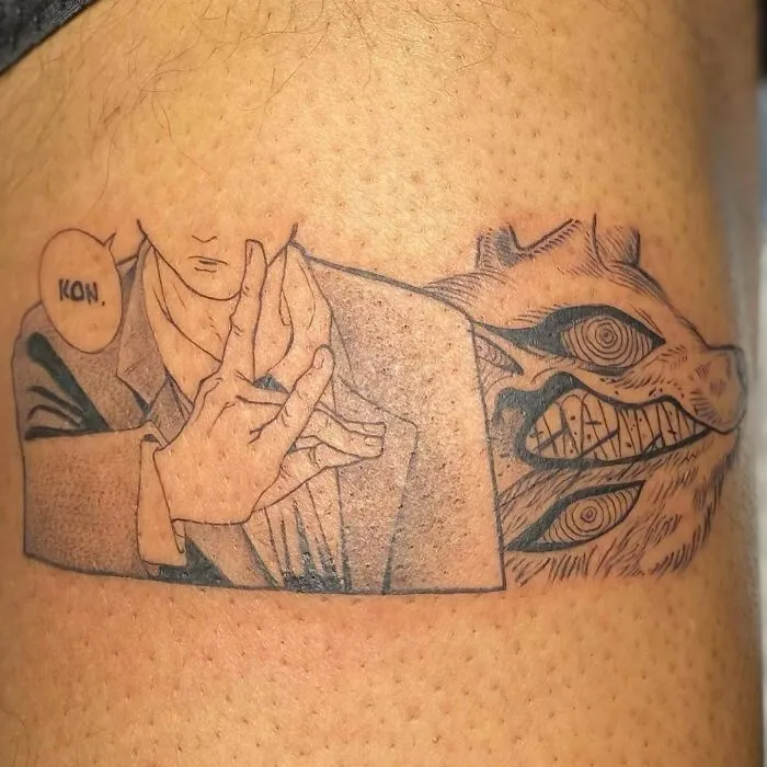 Anime tattoo depicting a panel featuring a character and a grinning monster, detailed line art style.