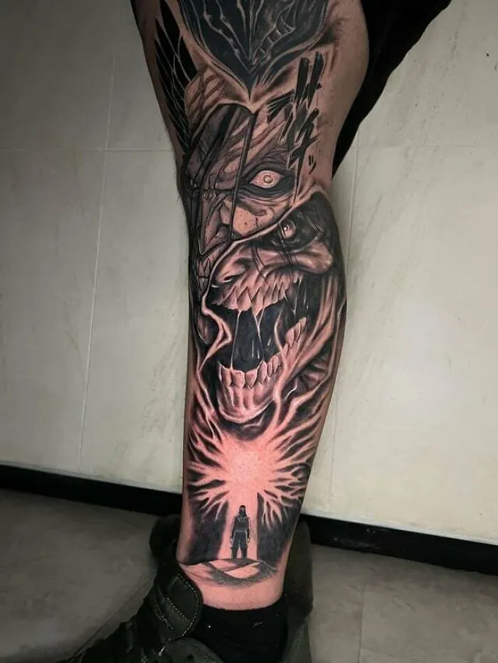 Anime tattoo featuring a dramatic scene with a roaring creature and a silhouetted figure, showcasing intense artistry.