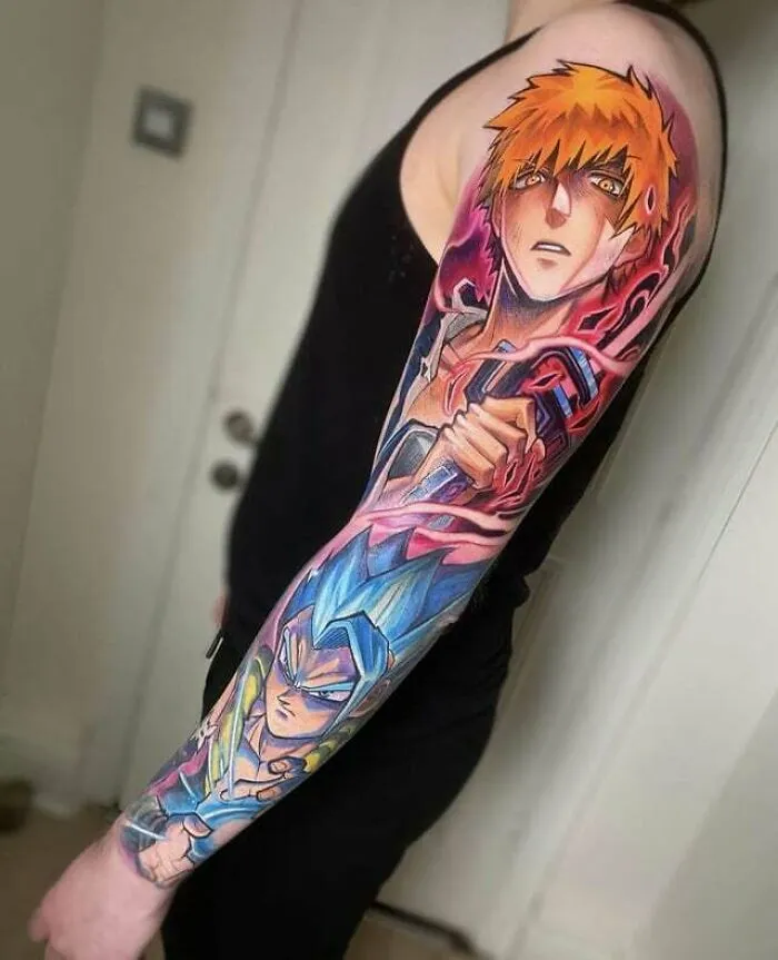 Anime tattoo sleeve with vibrant characters on a person's arm in a black tank top.