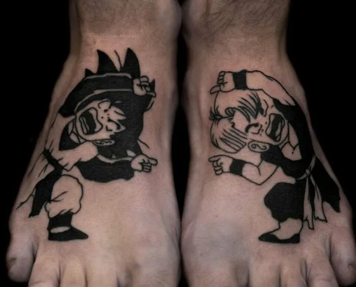 Anime tattoos on feet featuring two characters in dynamic poses.