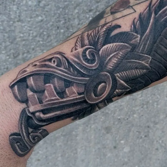 Detailed dragon tattoo design on forearm, showcasing intricate scales and fierce expression.