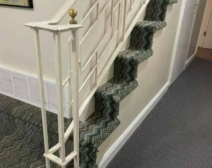 Ventilation Grill At The Bottom Of The Enclosure Suggests That Installing Air Conditioning Was More Desired Than A Usable Stairway. Or These Are Cat Stairs