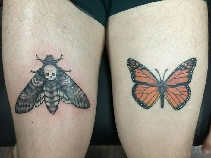 Colorful butterfly tattoos on thighs, featuring a monarch and a death's-head hawkmoth design.