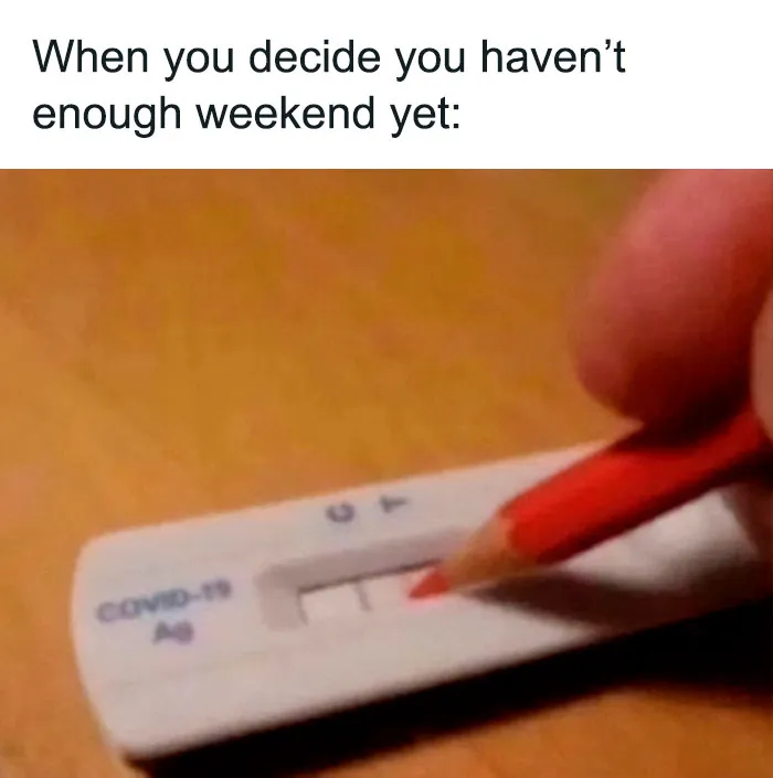 Red pencil marking a COVID test with "weekend" meme text above, capturing witty weekend humor.