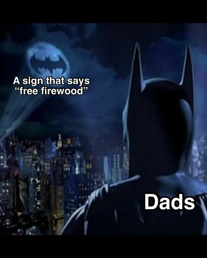 Batman meme with "free firewood" signal in the sky, labeled "Dads," reflecting classic dad humor.