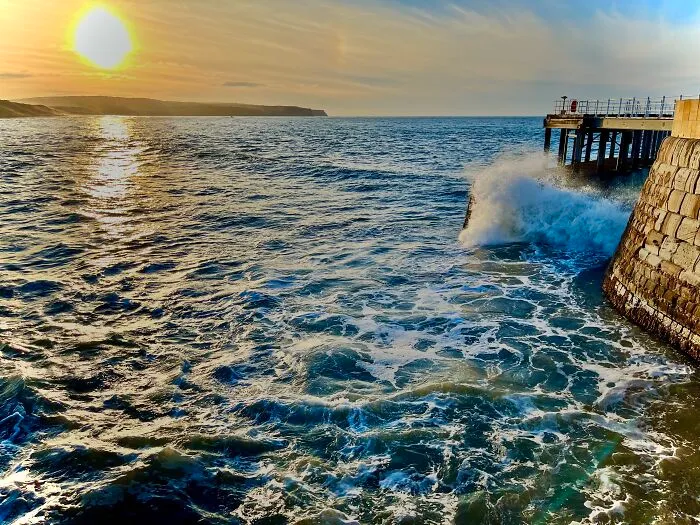 Sunset On A Foamy Sea