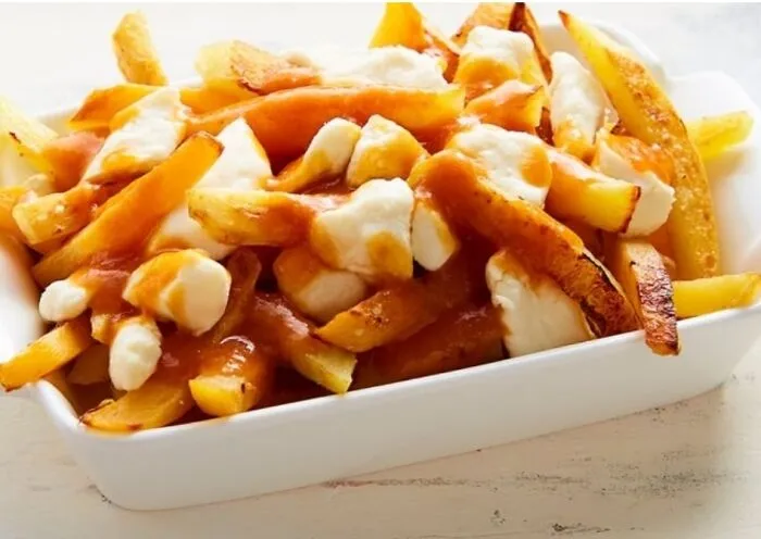 Poutine, It's Cheese Curds, French Fries And Gravy. Mmm Poutine. Quebec Canada