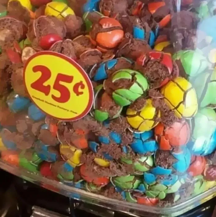 Crushed candies in a jar with a 25-cent label, representing a cursed meme from an IG page.