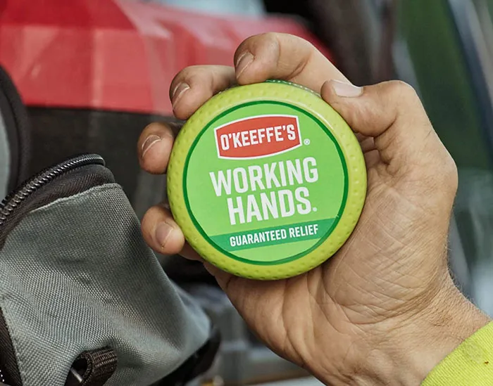 Man holding green hand cream 