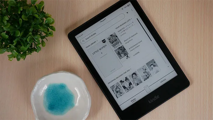 Black kindle on the brown  table 