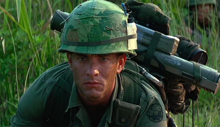 Forrest Gump in military gear during training, focused and ready, illustrating iconic Forrest Gump quotes.