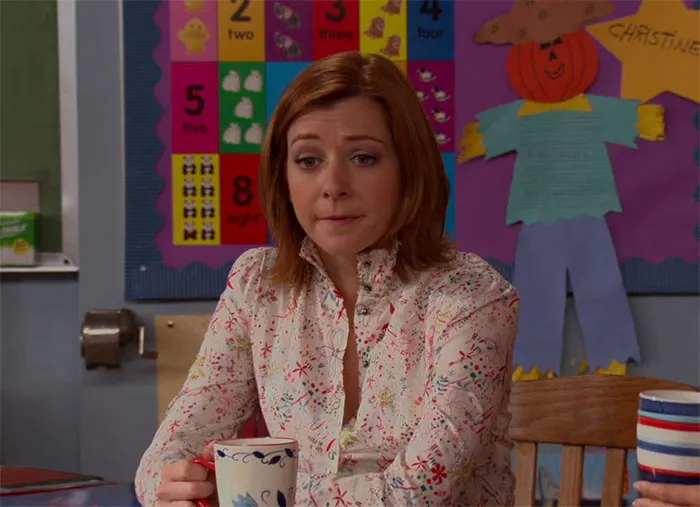 Lily Aldrin drinking tea in classroom