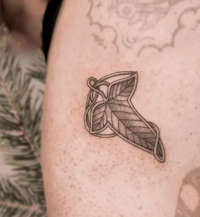 Elvish leaf Lord of the Rings tattoo on a person's arm.