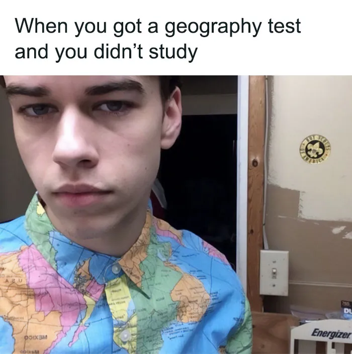 Person wearing a map shirt, face showing concern, with a humorous caption about a geography test. Science memes humor.
