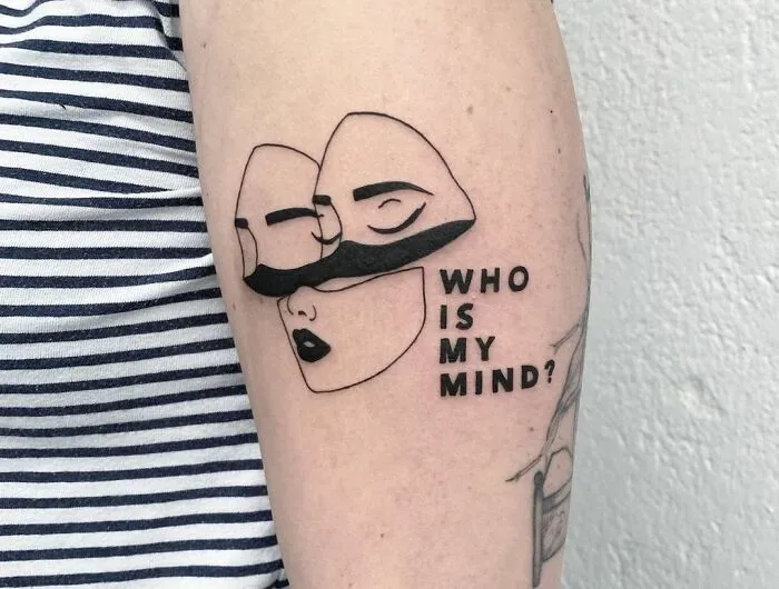 Abstract face tattoo with the words "Who is my mind?" representing mental health themes.