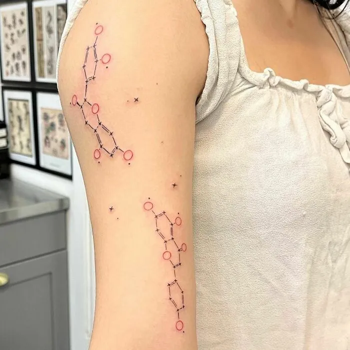 Science tattoos featuring DNA molecule design on arm, perfect for aspiring scientists.