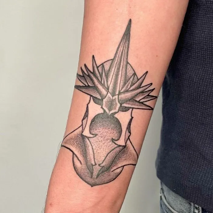 Arm featuring a bold black and gray Lord of the Rings inspired tattoo design.