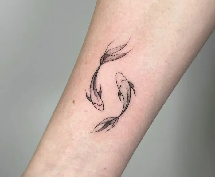 Fine Line Pisces Wrist Tattoo