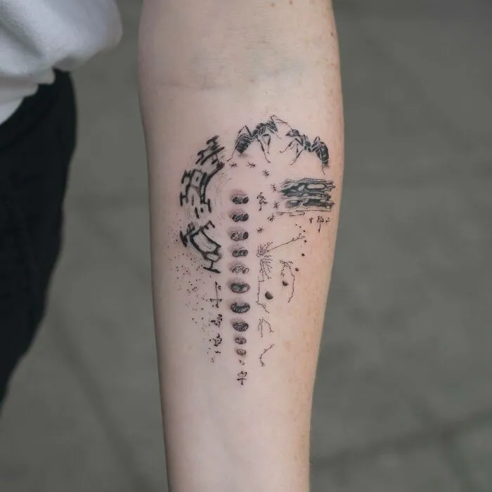Detailed science tattoo featuring abstract designs on a person's forearm.