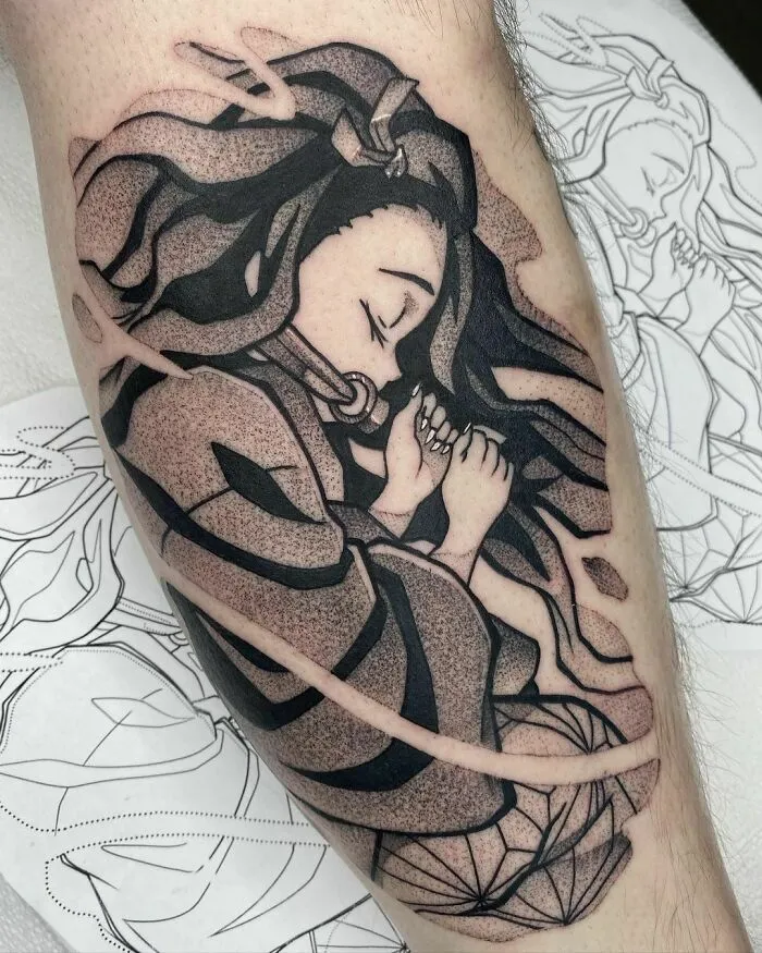 Anime tattoo featuring a detailed portrait of a character with flowing hair and traditional attire on a person's arm.