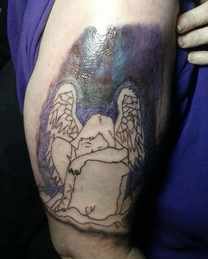 Angel tattoo with wings on skin, highlighting common inked design mistakes.