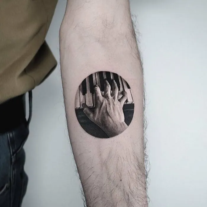 Playing Piano Forearm Tattoo