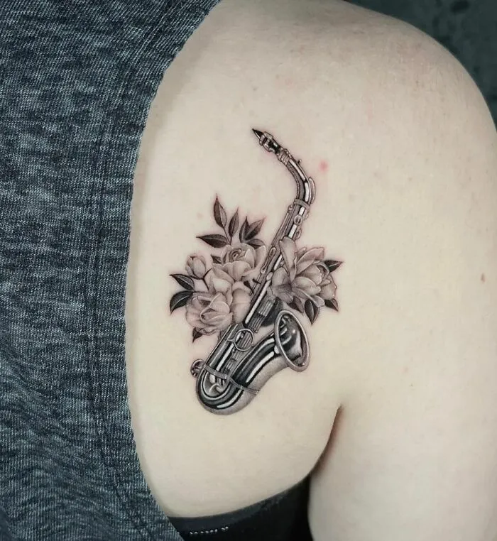 Realistic Saxophone With Flowers Tattoo