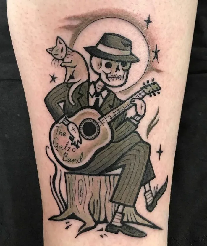 Skelly Playing Guitar Tattoo
