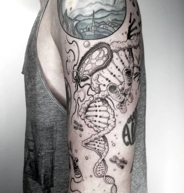 Arm tattoo featuring scientific designs including DNA and bacteria, perfect for science enthusiasts.
