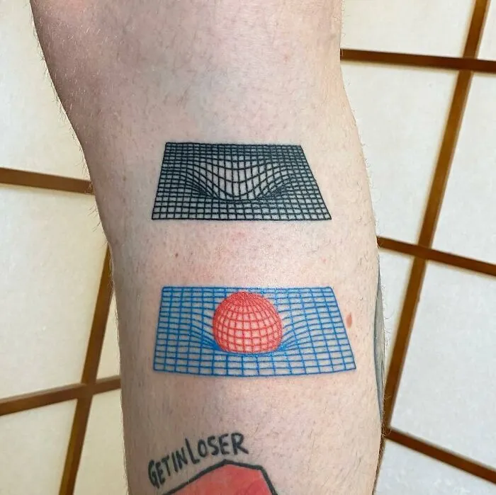 Science tattoos featuring gravity wells and a grid with a sphere on a person's arm.