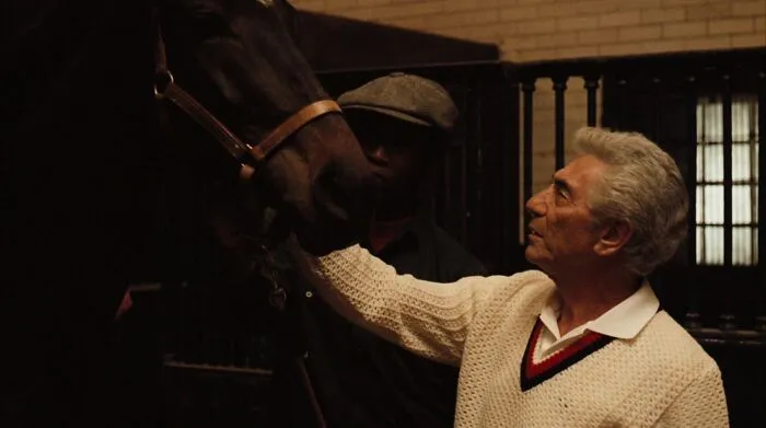 Jack Woltz petting a horse 
