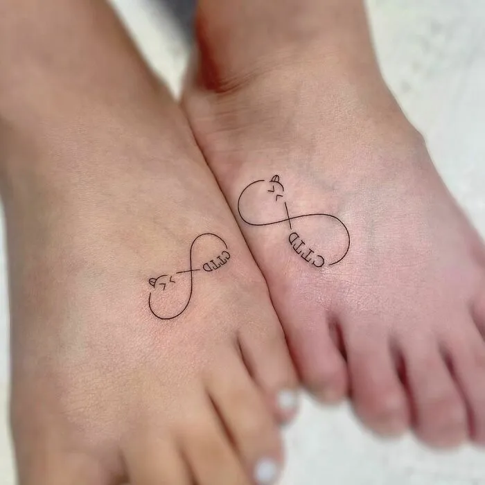 Infinity tattoos with cat ears on feet, showcasing creativity and style.