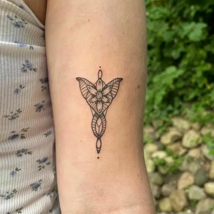 Elven-inspired Lord of the Rings tattoo on forearm with intricate design details.