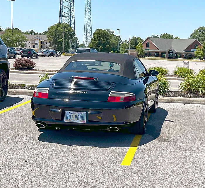 The Parking Job Was Pretty Bad And The "Not Poor" License Plate Was The Cherry On Top