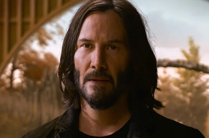 Keanu Reeves wearing brown jacket