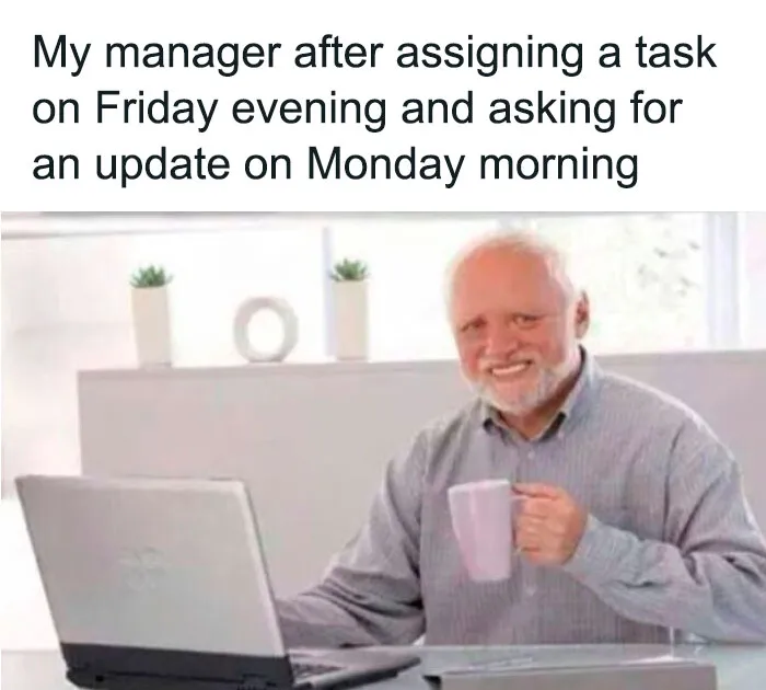 Elderly man smiling awkwardly with a coffee mug in front of a laptop, illustrating Monday memes humor.