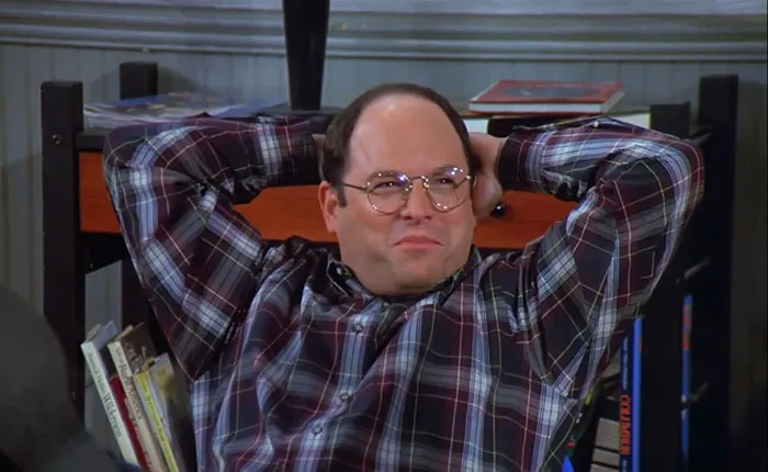 George wearing colorful shirt, relaxed and smiling, capturing a moment from the funniest Seinfeld quotes about everyday life.
