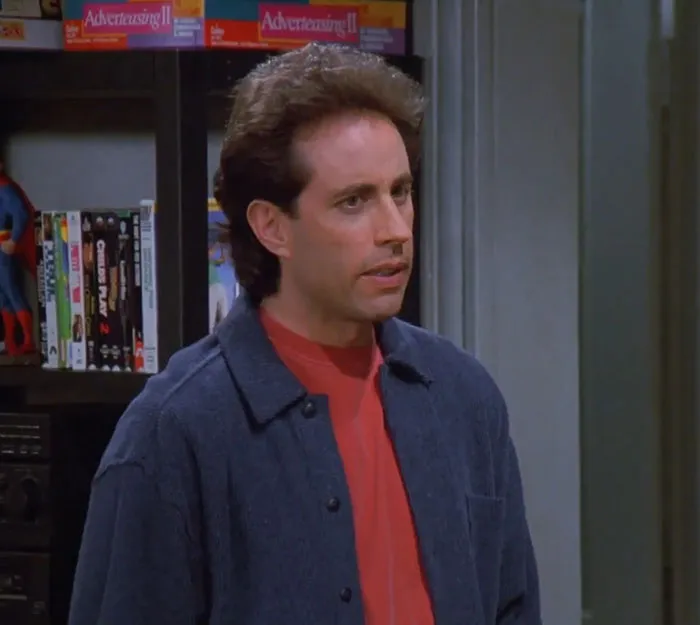 Jerry from Seinfeld wearing a blue jacket and red shirt, representing funniest Seinfeld quotes about everyday life humor.
