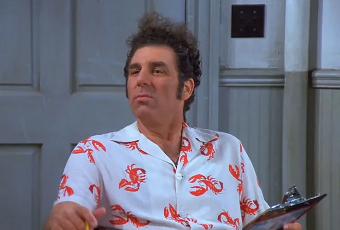 Cosmo Kramer wearing a white shirt with red crabs, illustrating one of the funniest Seinfeld quotes about everyday life.